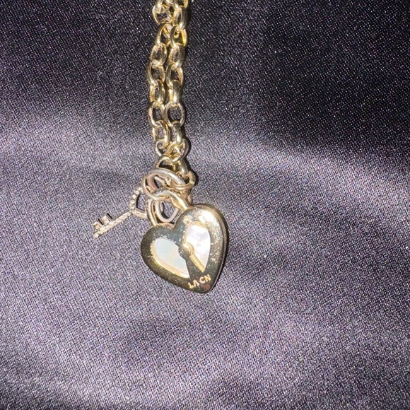 Cubic Zirconia Key and Genuine Mother of Pearl
Inlay Stone Heart Necklace - Picture 3 of 7